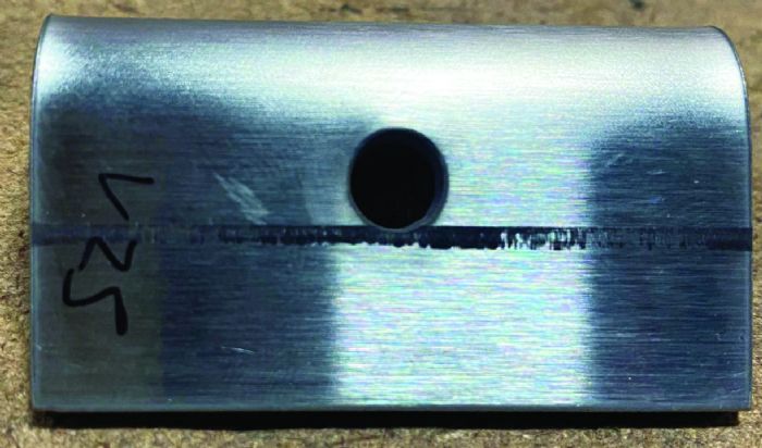 Press Brake Deformation Management: Innovative Solutions to Prevent Feature Distortion - Pictures 6 Fig. 2 - One way to prevent hole deformation: Pilot a hole and then drill it out to size after the part has been bent. In this part, a ¼-in.-dia. pilot hole was made during blanking, with a larger hole drilled post-forming.