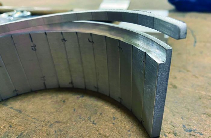 Press Brake Deformation Management: Innovative Solutions to Prevent Feature Distortion - Pictures 12 Fig. 8 - Press brake operators can prevent deformation on a machined surface by using a sacrificial blank to take up the space.