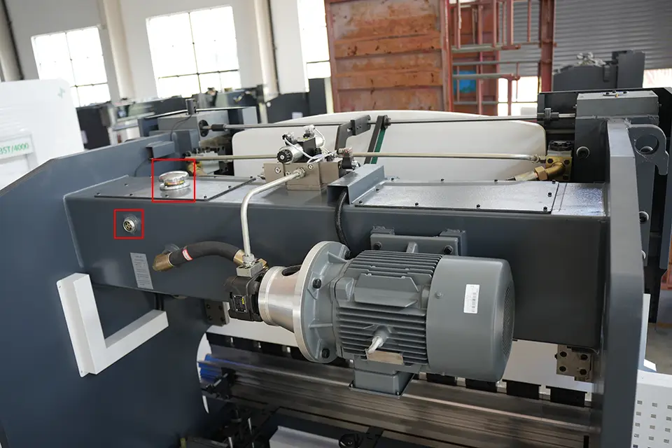 NC press brake with E21 installation - I - Pictures 10 NC press brake hydraulic oil filler port (upper right) and inspection port (lower left)