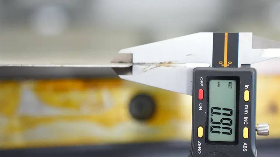Operation process of vertical v grooving machine - Pictures 14 Measuring thickness of sheet metal